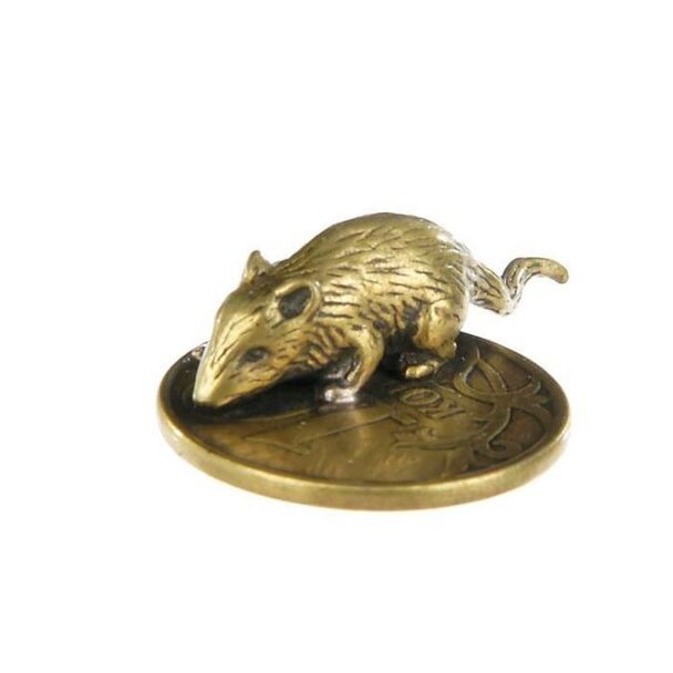 A wallet mouse charm with coins for good luck in money matters